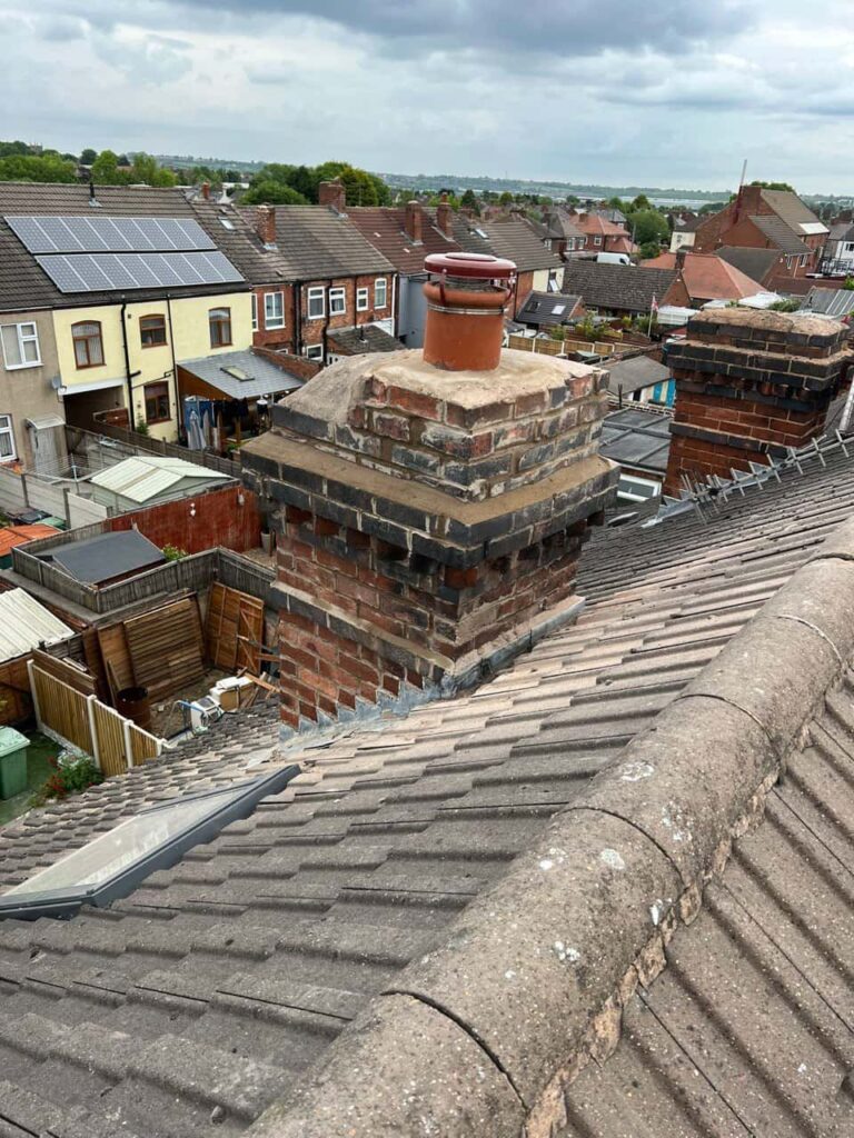 This is a photo taken from a roof which is being repaired by South Wigston Roofing Repairs, it shows a street of houses, and their roofs