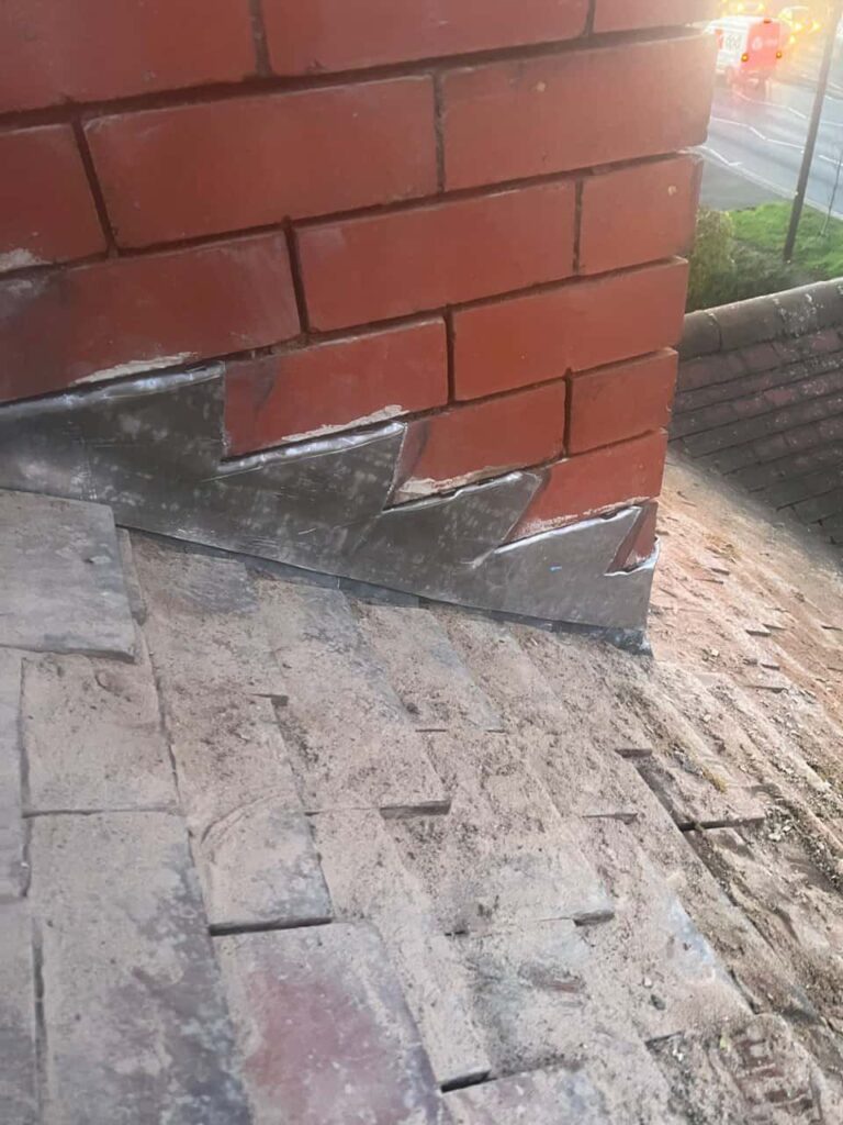This is a photo of new leadwork being installed around an old chimney. Works carried out by South Wigston Roofing Repairs